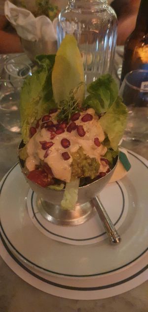 (Starter) AVOCADO AND
TOMATO COCKTAIL
:
Red pepper, lettuce and pomegranate dressed with a spicy harissa sauce at The Ivy in Manchester