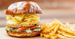 Crazy Good Grilled Chicken Sandwich

plant-based grilled chicken, plant-based provolone, parmesan truffle potato chips, roasted tomatoes, arugula, truffle aioli,  pretzel bun at Native Foods - The Loop in Chicago