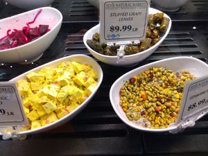 Vegan eggless salad, grape leaves, and edamame on 11/5/22 in deli case at Ada's Natural Market & Cafe in Fort Myers