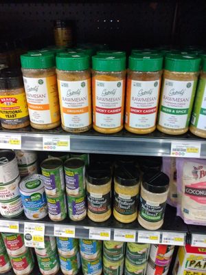 Nutritional yeast, vegan parmesan, and canned coconut products at Ada's Natural Market & Cafe in Fort Myers
