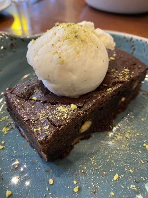 Vegan chocolate brownie with ice cream  at Il Forno in Bournemouth