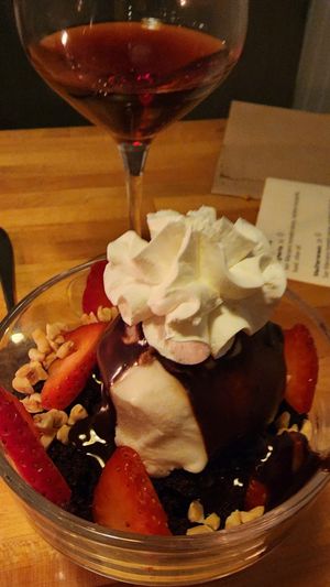 Gelato over warm brownie and strawberries at Osteria Du in Toronto