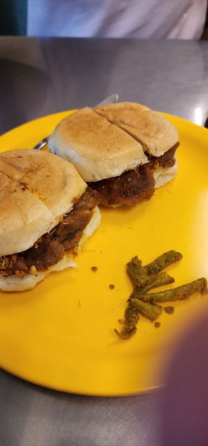 The yummiest dabeli - ask for it without butter. A Gujarati street snack that has a flavorful mashed potato mix in local bread with some masala peanuts, fresh pomegranate and some  at Swati Snacks - Mumbai in Mumbai