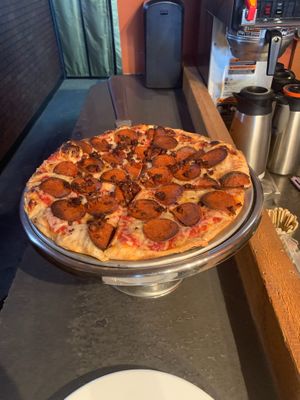 A vegan meat lovers pizza with Daiya cheese, vegan pepperoni, and ground round. at Pizza Pi in Kamloops