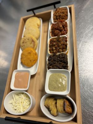 Arepita con jackfruit, chickpeas, ground meat with red lentils and black beans. Cheese violife and plantain.   at Origamy Gelato in Sunrise