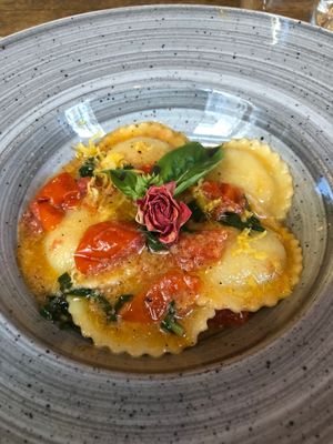 “Cheese” (I think cashew or almond) Ravioli with tomato sauce, basil and lemon + zest. Incredible! 😋  at aTipico in Palermo