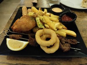 Mixed plate with arancini, skewers, cheese sticks and more at aTipico in Palermo