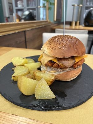Crispy Burger with bacon and cheese, potato wedges   at aTipico in Palermo
