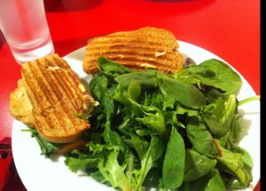 vegan chicken spinach and artichoke panini with side salad.  dip the panini in the balsamic vinegar for extra flavour! at Red Velvet Cafe - Fashion Show Mall in Las Vegas
