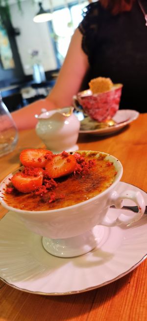 Vegan creme brulee!!! Backround there's affogato. at Bistro Vilja in Tampere