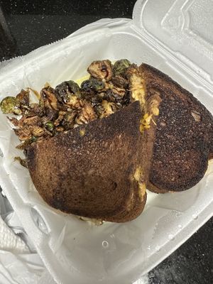 Rubén with fried Brussels   at Steady Eddy's Cafe at the Market in Flint