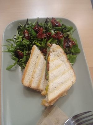 Vegan toasted sandwiches with arugula, balsamic glaze and dried tomatoes salad. at Kavárna Nota in Pardubice