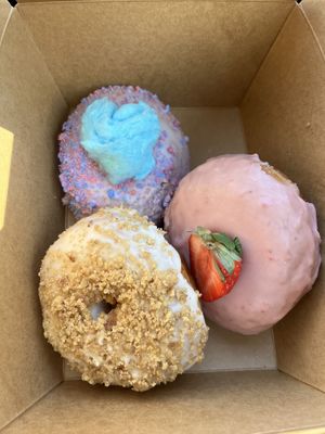 Cotton candy, strawberry, and snickerdoodle donuts  at Cloudy Donut Co. - Charles St in Baltimore
