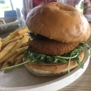 Veggie Burger (plant based schnitzel, field mushroom, rocket, & the mozzarella and truffle mayonnaise they forgot to take off 🤦)  at Auckland House in Gladstone