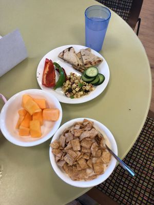 grilled pita and veggies and cereal and melon  at Mean Greens in Denton