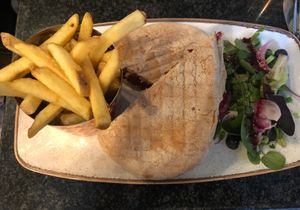 Vegan falafel and hummus deli sandwich with skin on fries. at Brambles Bistro in Robin Hoods Bay