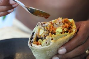 Our signature burrito: Homemade flour tortilla with a delicious Mexican seasoned chorizo of soy, quinoa, black beans, corn & guacamole  at Northswell Sabor Natural in Sayulita