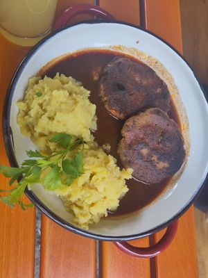 Selfmade vegetable roast in dark gravy and potato salad at Landgasthof Löwen in Aitrach