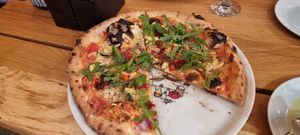 Vegetable pizza made with vegan cheese at Pinokio Pizzeria in Zakopane