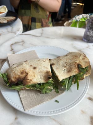 Cashew ricotta, courgette and rocket sourdough panini and an acai smoothie   at Di Marzano Cafe Vermuteria in Lisbon