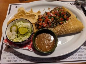 Pancake of the month: Sumatran Rendang with a jackfruit based curry-like topping, salad, sate sauce and chips. at D' Olle Smidse in Midwolda