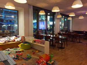 Interior and play area at Uno e più in Kriens