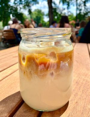 Iced oat latte at Skautský Institut v Rybárně in Prague