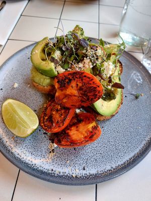 Avo toast + tomato at Nine Yards in South Melbourne