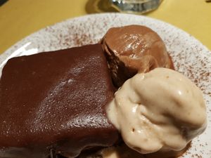A vegan version of the traditional Viennese Sachertorte with a scoop of Coco-Nocciola and a scoop of Coco-Choco. at In un Angolo di Mondo in Acireale