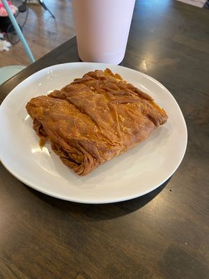 Vegan spanikopita, a Greek pastry with vegan cheese and spinach in layers of flakey pastry, heated when ordered for here. at Koupa Espresso Bar in Haddon Township