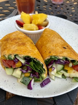 Vegan wrap with side of fresh fruit    at Shelf Indulgence Used Book Cafe in Sarasota