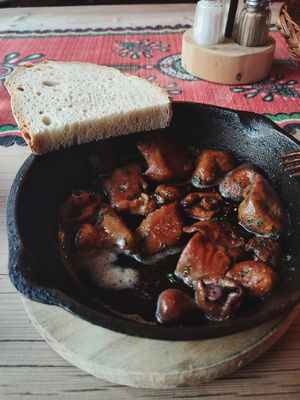 Saffron milk cap mushrooms fried in olive oil and herbs and homemade bread at Karczma Sabała in Zakopane