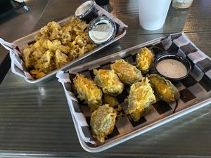Vegan Jalapeño Poppers - jalapeño stuffed with Impossible ground beef and Vegan shredded cheese. Hand battered in our Vegan tempura batter. Served with our house made Vegan Ranch at Torque Grill & Cantina in Burleson
