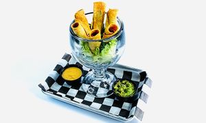 Flautas made with Impossible seasoned ground beef.  Servied with house made vegan queso & guacamole. at Torque Grill & Cantina in Burleson