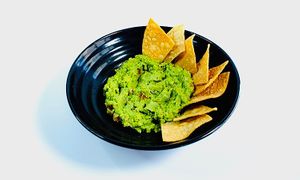 House made fresh guacamole served with house made chips. at Torque Grill & Cantina in Burleson