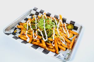 Loaded Fried served with meat choice (Impossible in house seasoned ground beef, sauteed mushrooms, fresh made walnut ground beef. at Torque Grill & Cantina in Burleson