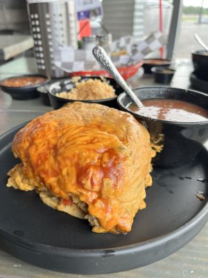 Stacked enchiladas with rice and beans  at Torque Grill & Cantina in Burleson