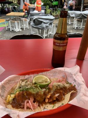 Vegan cauliflower & pineapple tacos. Sorry I covered them with salsa & pickled onions LOL  at Criminal Taqueria in Medellin