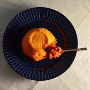 Tagine Pudding - a sweet potato pudding, filled with a chickpea tagine and served with a salted caramel Disaranno sauce. at Homegrown in Urmston