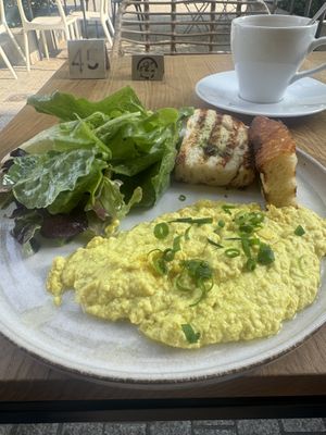 Vegan scrambled tofu with greens and bread   at Karma Organic Coffee in Krakow