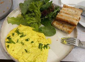 scrambled tofu with salad and breadd  at Karma Organic Coffee in Krakow