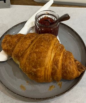 croissant with strawberry jam  at Karma Organic Coffee in Krakow