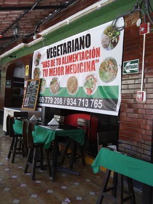 Poster and menu on patio area at Restaurante Union Vegetariano in Lima