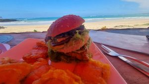 Smoked burger with patacones instead of fries at Don Sanduchito in Puerto Villamil