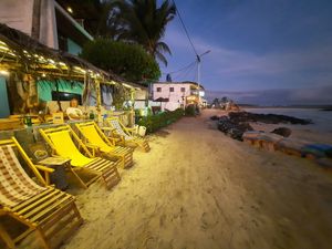 Restaurant on the left, right on the beach at Don Sanduchito in Puerto Villamil
