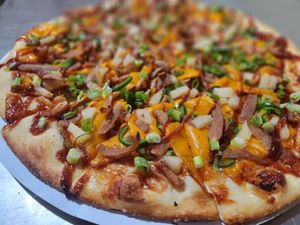 The newest VEGAN addition to the menu....
Sweet Baby Rays, V-Pork, V-sharp cheddar, fresh jalapenos, pineapple, finished with green onion at Task Force Pizza Co in Fort Walton Beach