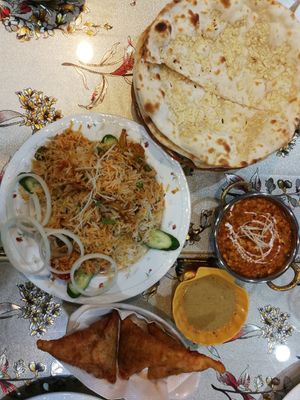 Veg biryani, samosas and dip, daal, garlic naan. at Madina Indian Bistro in Hualien