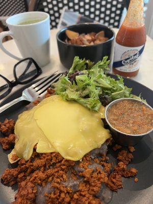 Vegan GF Chorizo Rancheros, Side Crispy Potatoes and Matcha Late w/ Almond Mlk.   at Blvd Cafe in Sarasota