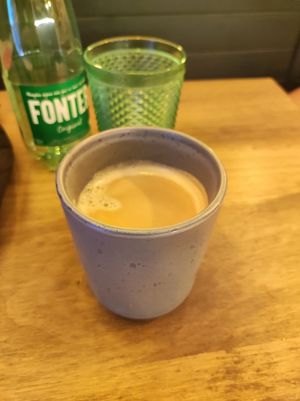 Coffee in stone cup at Meet Vegano in Malaga