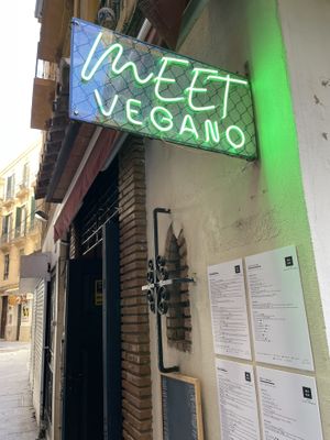 Entrance sign and menus  at Meet Vegano in Malaga